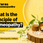 Homeopathic medicine bottle with white remedy pellets, natural herbs, and Paras Homeopathy branding illustrating the principle of homeopathy and natural healing.